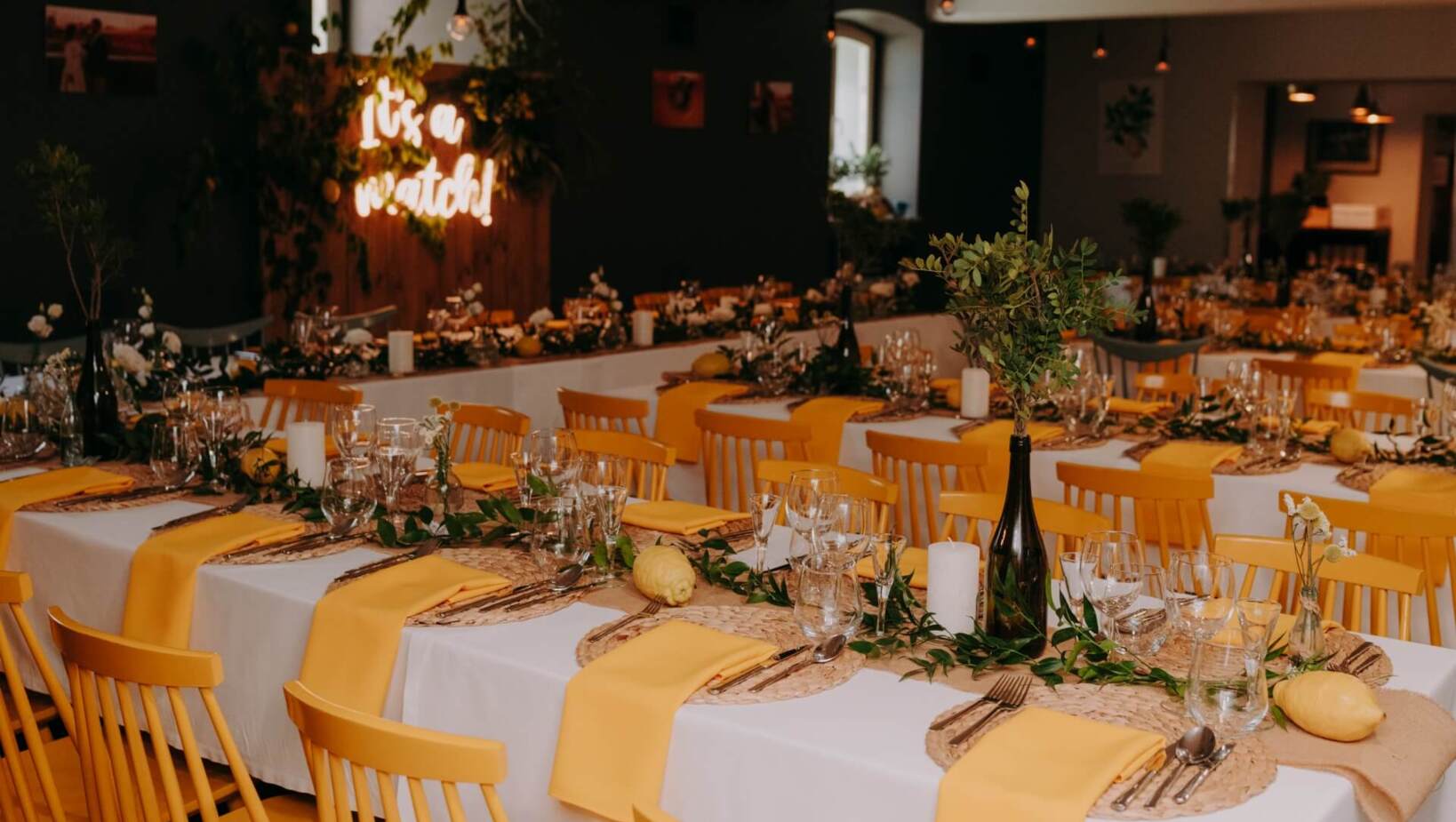 Wedding hall with colorful flowers and rustic styled table settings