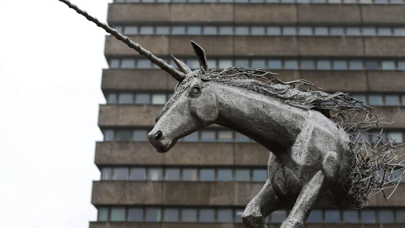 Metal unicorn monument in the urban space of Łódź