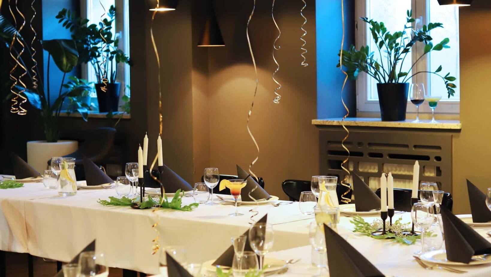 Elegantly decorated dining room with balloons for birthday party