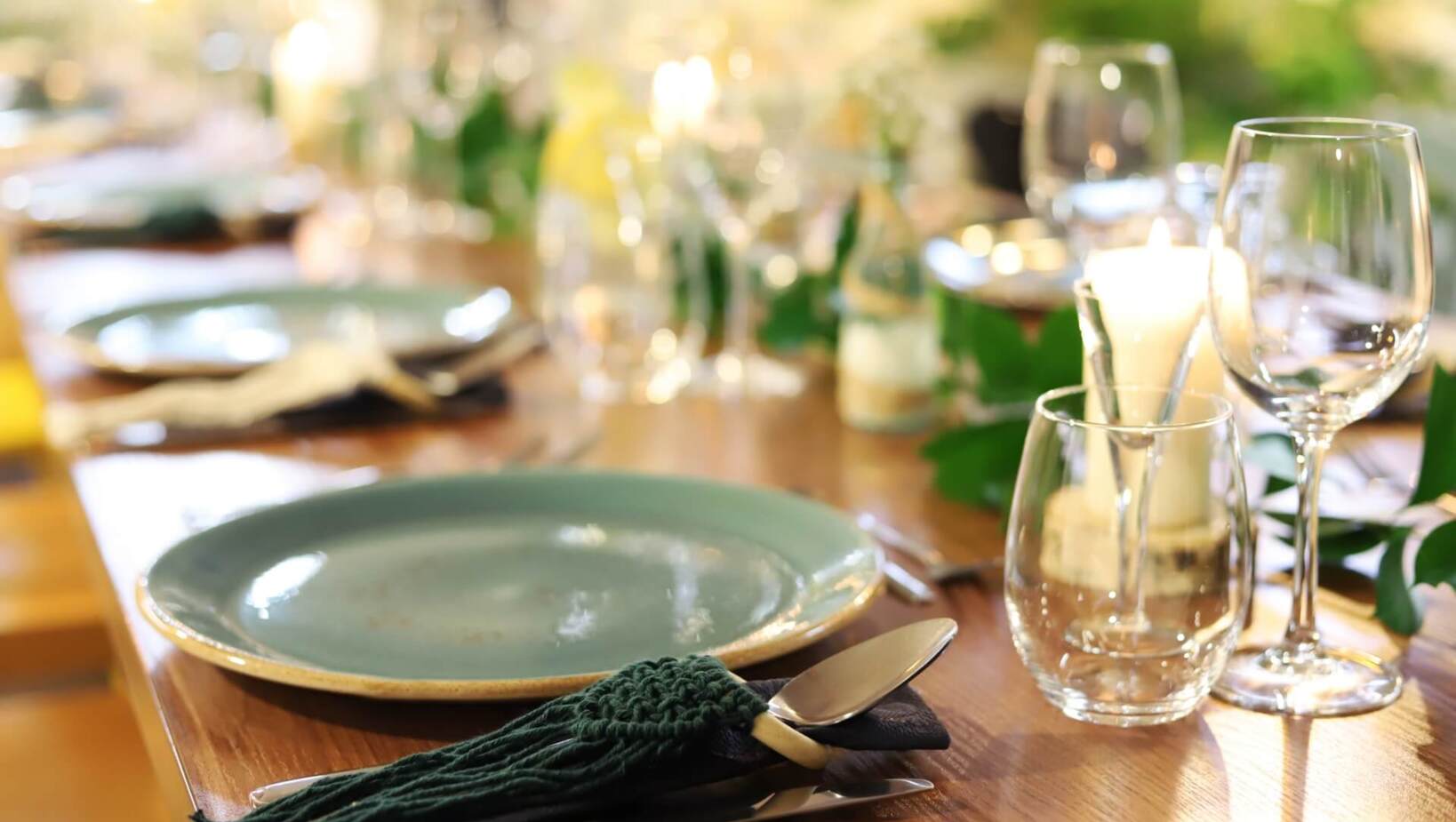 Tableware in green shades on restaurant table