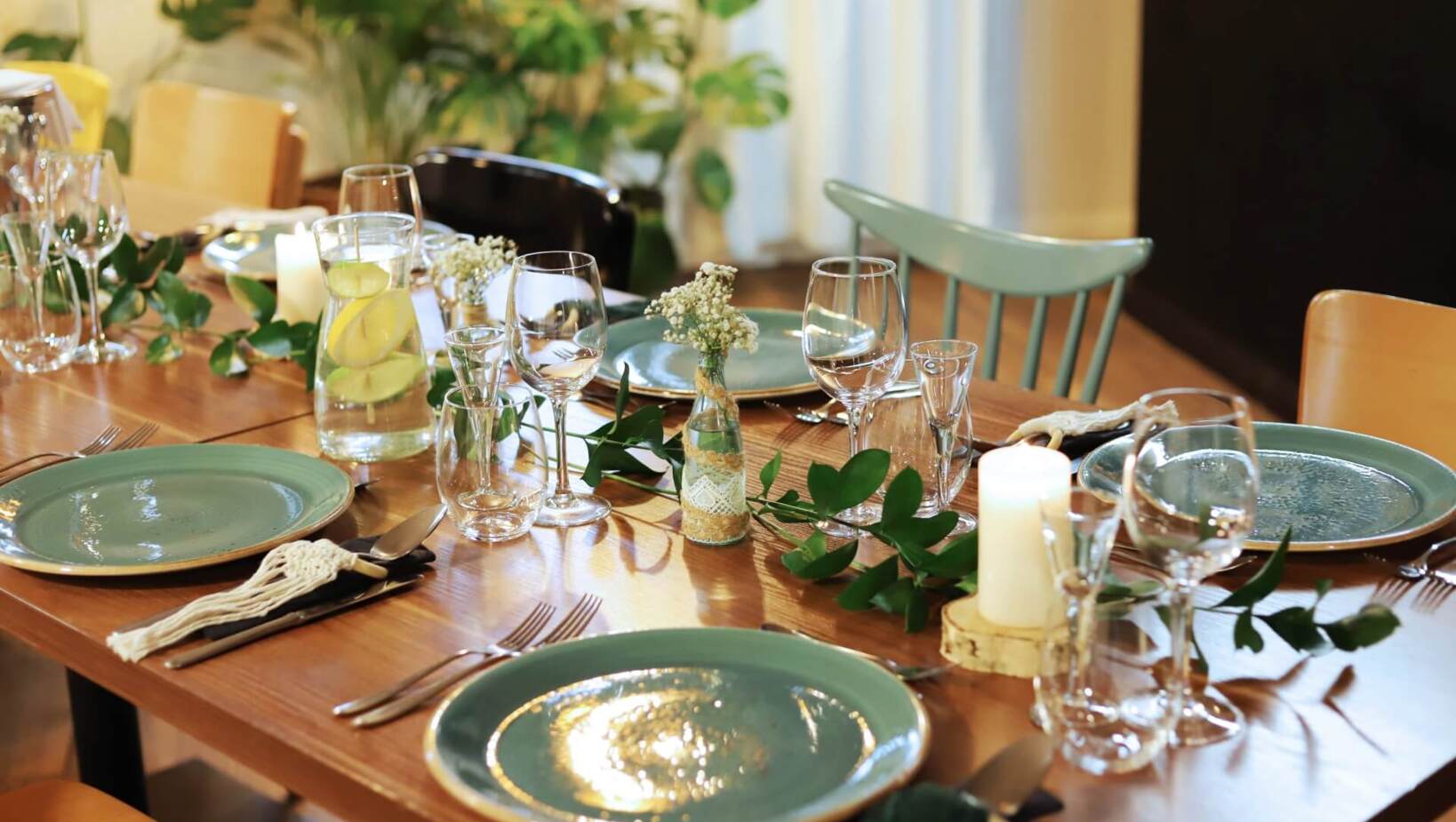 Rustic decorated table with eucalyptus accents and dinnerware