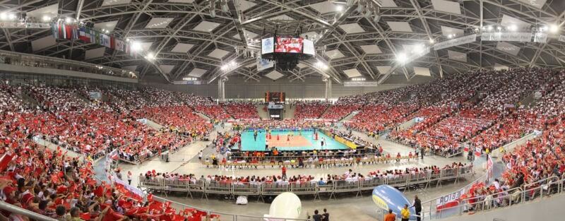 Interior of sports hall during a volleyball match with spectators