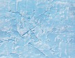 Four wooden music notes on a textured pale-blue painted background, decorative wall art with a musical theme