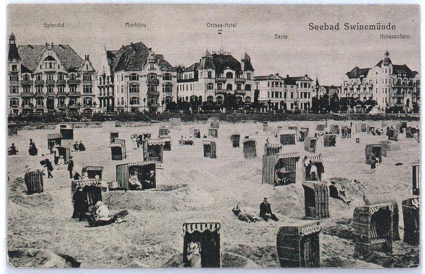 Historyczne nadmorskie hotele z widokiem na plażę z tradycyjnymi koszami plażowymi i wypoczywającymi gośćmi