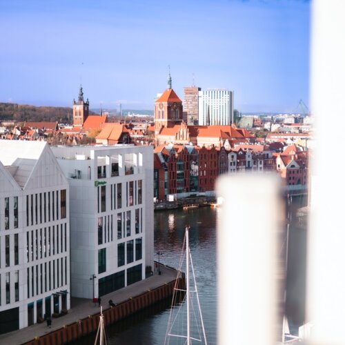 View from a tall building of the Old Town in Gdańsk and a part of the Motława River.