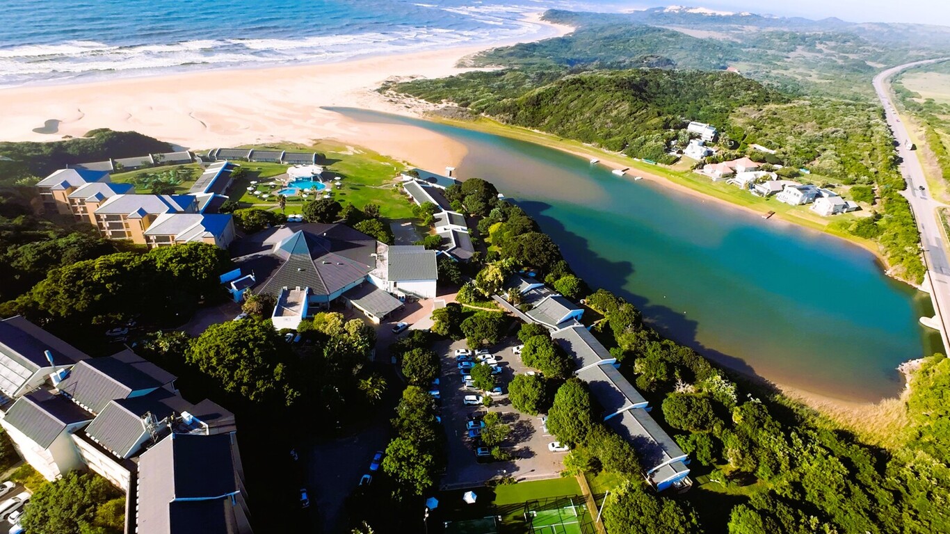 Aerial view of Mpekweni Beach Resort beside the lagoon and Eastern Cape coastline