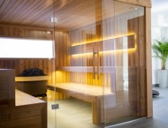 A modern steam sauna with soft lighting creating a relaxing atmosphere
