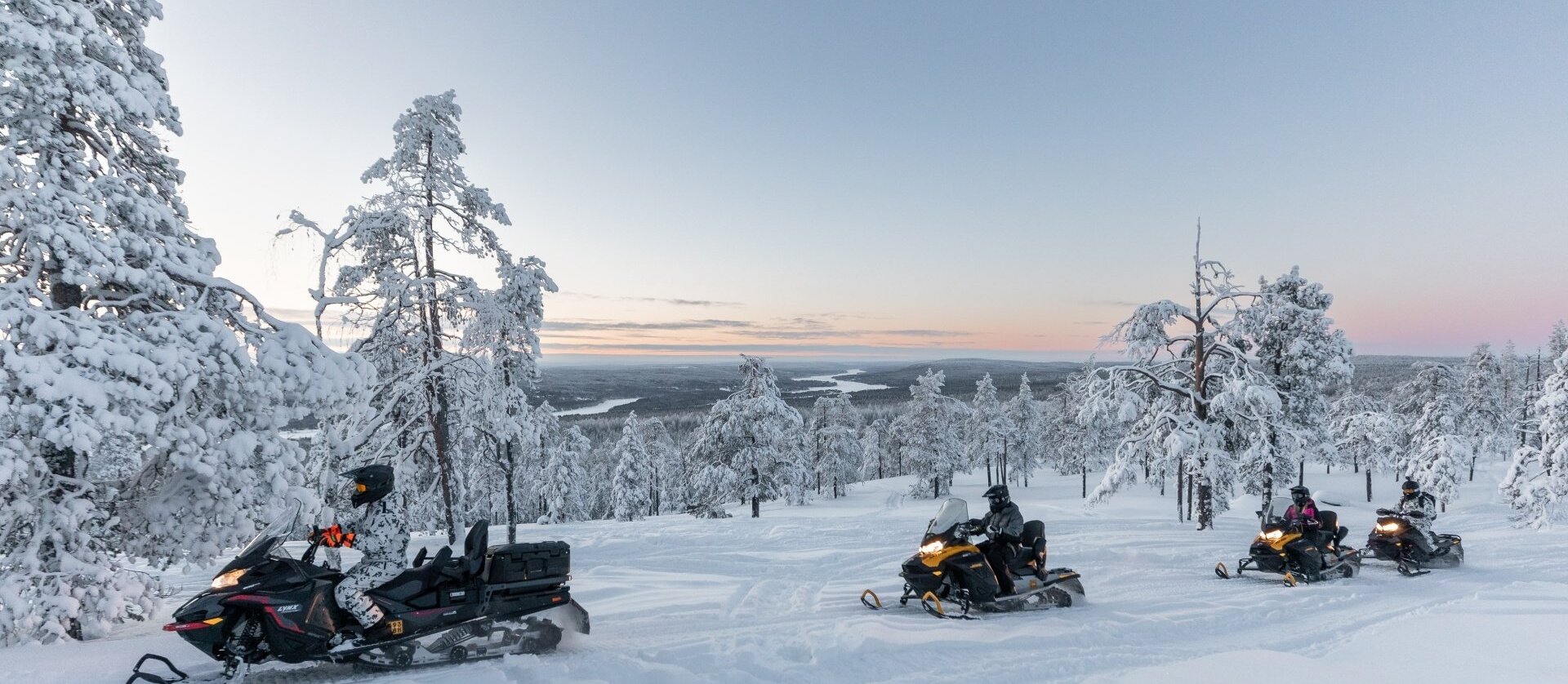 Customers enjoying a snowmobile experience at Nova Galaxy Village