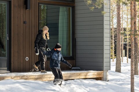 Kids outside the Nordic Cottage at Nova Skyland Hotel