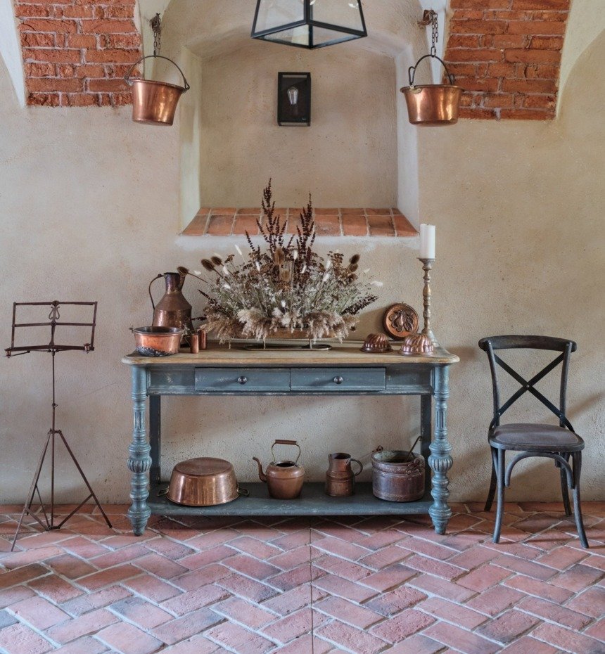 The Restaurant in Kamieniec Palace. Brick arches. Antique copper pots