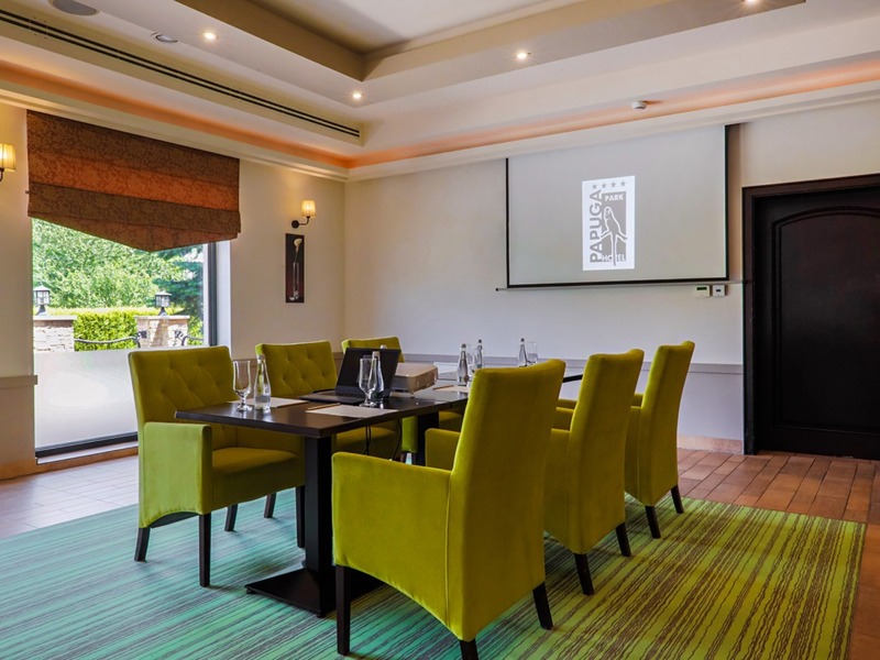 Hotel business room with garden view and comfortable furnishings