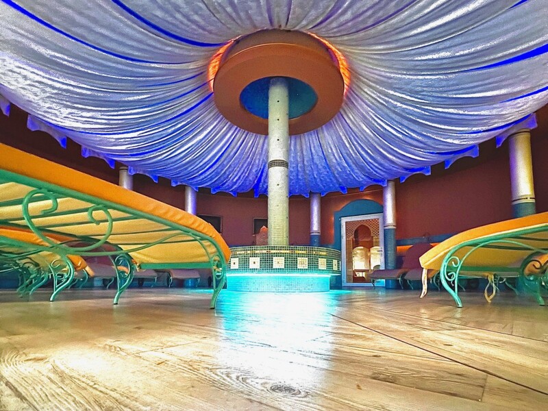 Armchairs and loungers under the canopy in the hotel's wellness area
