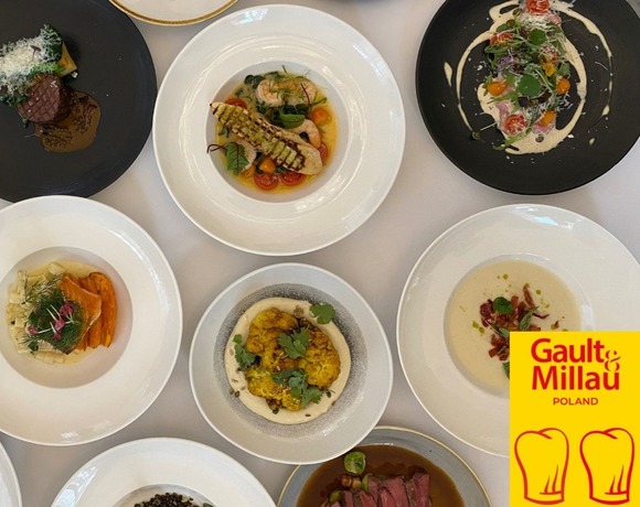 Assorted elegant gourmet plates on white linen—seafood, steak, roasted cauliflower and soups with Gault & Millau Poland logo.