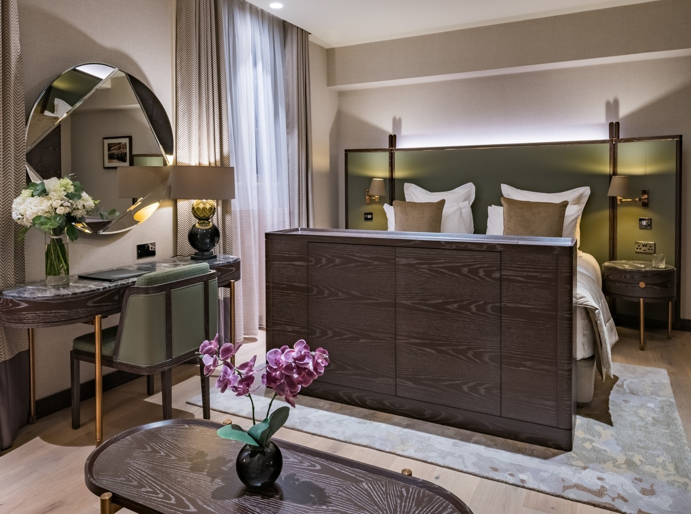 king size bed, a table, a desk by the wall