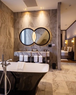 elegant marble high-ceiling bathroom, double mirror