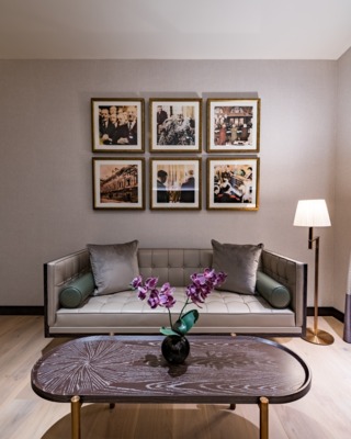 a sofa, room design, 6 pictures on the wall