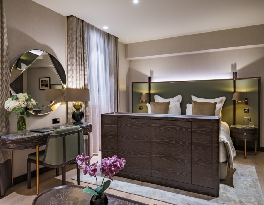 king size bed, a table, a desk by the wall