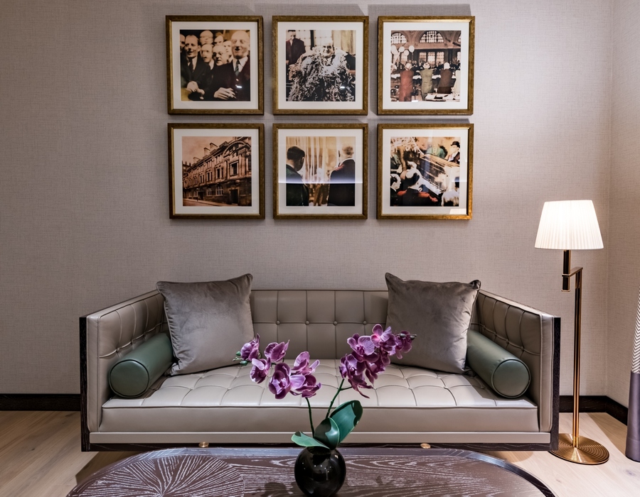 a sofa, room design, 6 pictures on the wall