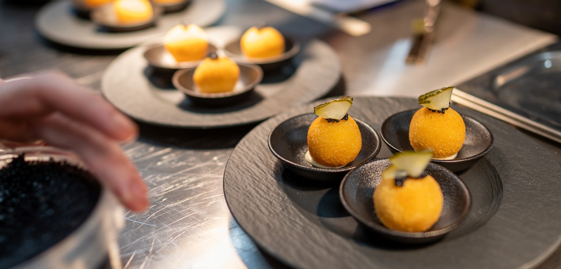 Savory spheres shaped like lemons served at Aihki restaurant.