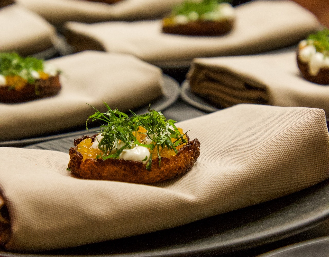 Eggs Benedict served on an elegant cloth at Aihki restaurant.