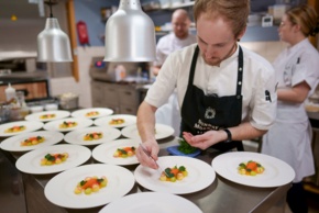 The souse chef at Restaurant Aihki preparing the dishes.