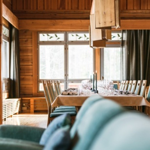 An elegant dining room in a timber lodge.