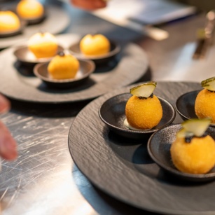 Savory spheres shaped like lemons served at Aihki restaurant.