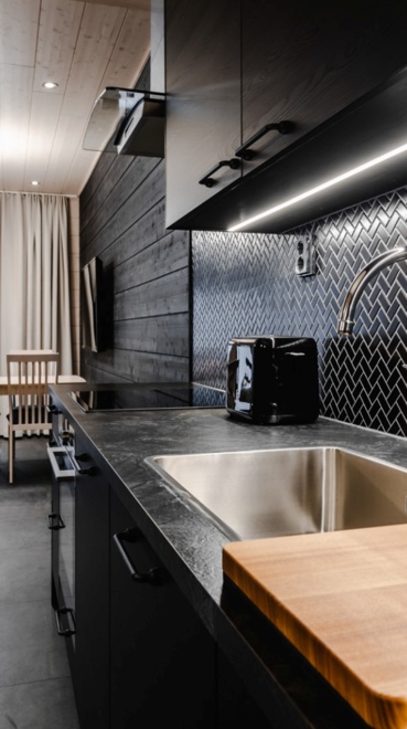 A black and elegant kitchen counter made from stone.