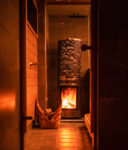 A tall furnace in the lakeside sauna.