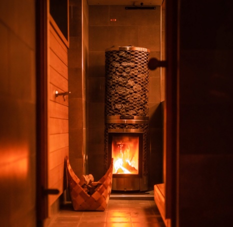 A tall furnace in the lakeside sauna.