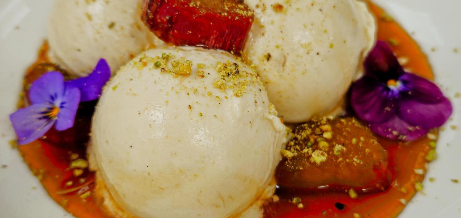 Italian-style ice cream prepared for Restaurant Week Krakow, served with edible flowers.