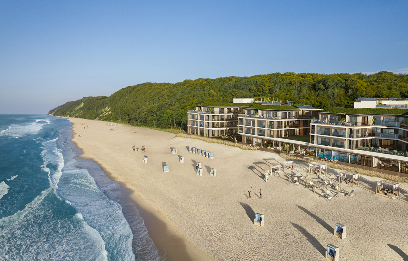 Nowoczesny nadmorski resort z tarasami, szklanymi apartamentami i zielonymi dachami, prywatne kabiny i leżaki na szerokiej piaszczystej plaży