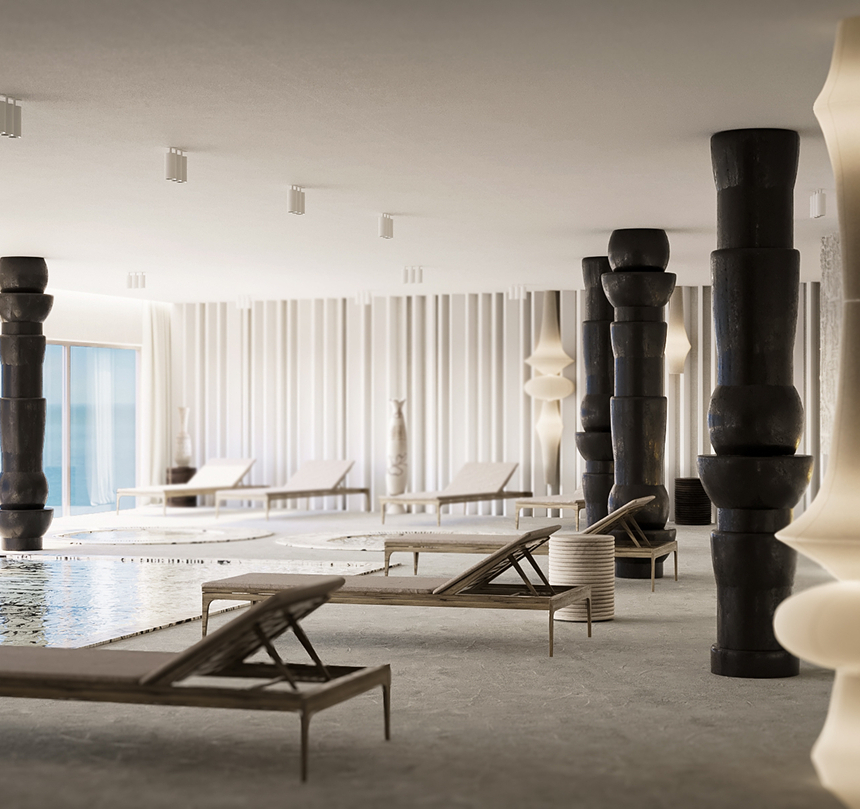 Strefa spa wewnątrz z płytkim basenem, leżakami, rzeźbiarskimi czarnymi filarami, panoramicznymi oknami z widokiem na morze i kominkiem