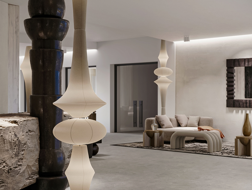 Nowoczesne lobby hotelowe z rzeźbiarskimi lampami, kamiennymi akcentami, zaokrągloną sofą i pufami na wzorzystym dywanie, miękkie oświetlenie