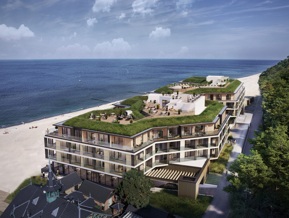 Modernes Hotel am Strand mit Glasbalkonen und begrünten Dachterrassen, Außenlounges, direktem Sandstrandzugang und Meerblick.