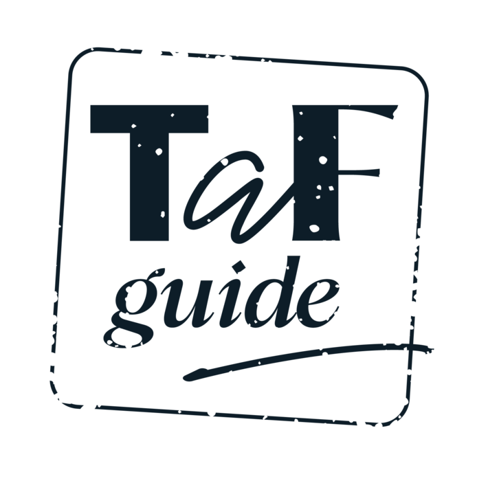 Czarno-biały stylowy napis "Taf guide" w prostokątnej ramce z delikatnym postarzeniem