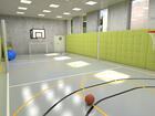 Hala sportowa w hotelu z koszami do koszykówki, jasnozielonymi wyściełanymi ścianami, dużymi oknami i sprzętem sportowym